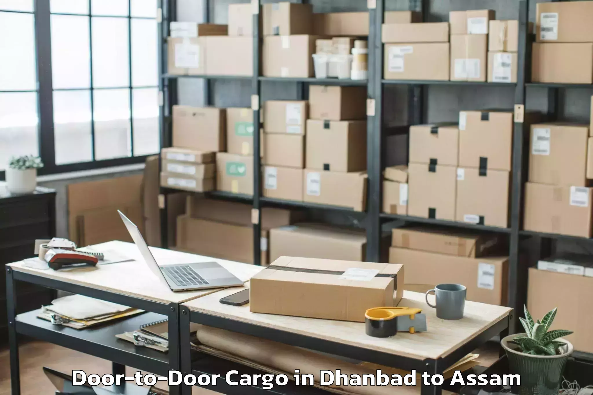 Easy Dhanbad to Borjhar Airport Gau Door To Door Cargo Booking